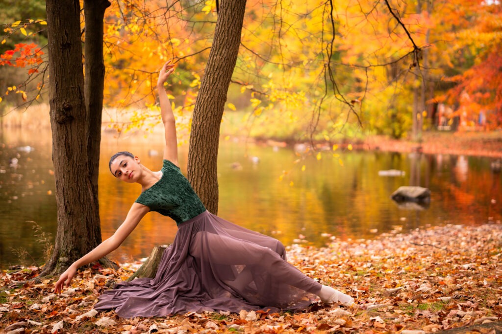 Dancer ballerina pose lake water fall autumn