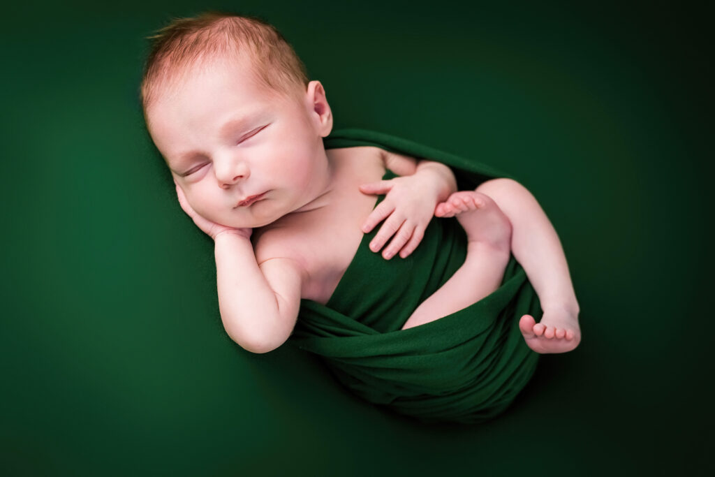 Baby boy newborn post studio green wrap