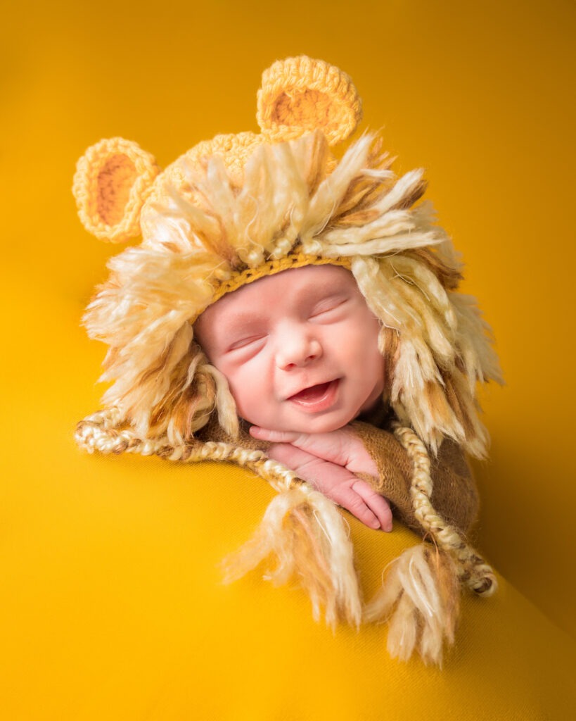 Newborn baby boy yellow smile lion